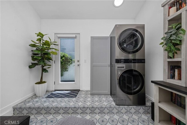 21322 S Western Ave, Torrance, CA 90501 - laundry room featuring stacked washer / drying machine, cabinet space, baseboards, and tile patterned floors