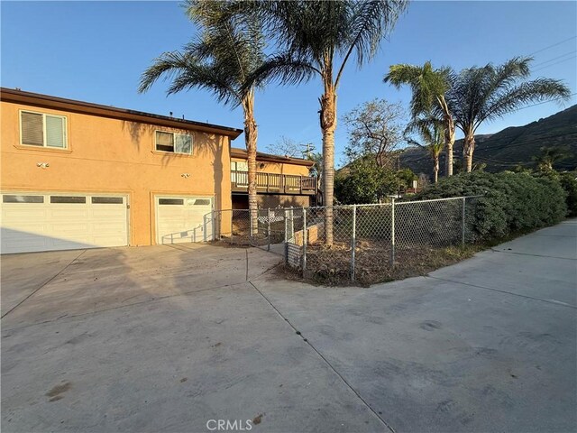 15192 Laguna Ave, Lake Elsinore, CA 92530 - view of building exterior with a garage and driveway