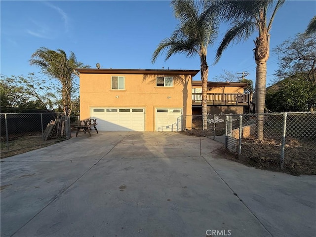 15192 Laguna Ave, Lake Elsinore, CA 92530 - view of front of house featuring an attached garage, stucco siding, and concrete driveway