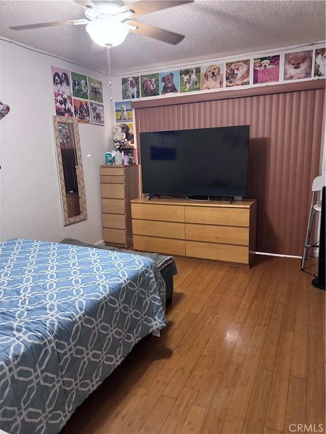 6223 Morse Ave, North Hollywood, CA 91606 - bedroom with light wood-type flooring, a textured ceiling, and ceiling fan