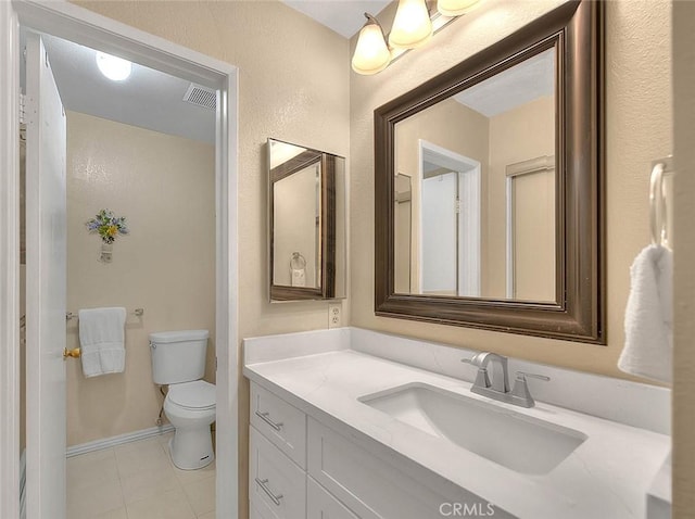 1189 N Sunflower Ave, Covina, CA 91724 - bathroom with toilet, vanity, and tile patterned flooring