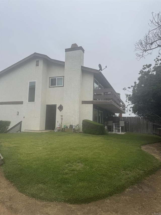166168 Coop Ct, Encinitas, CA 92024 - rear view of property with a chimney, a balcony, and stucco siding