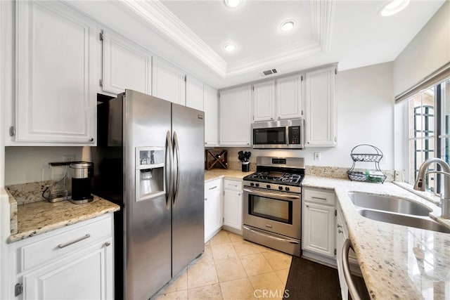 28747 La Triana, Laguna Niguel, CA 92677 - kitchen featuring appliances with stainless steel finishes, a sink, a raised ceiling, crown molding, and recessed lighting