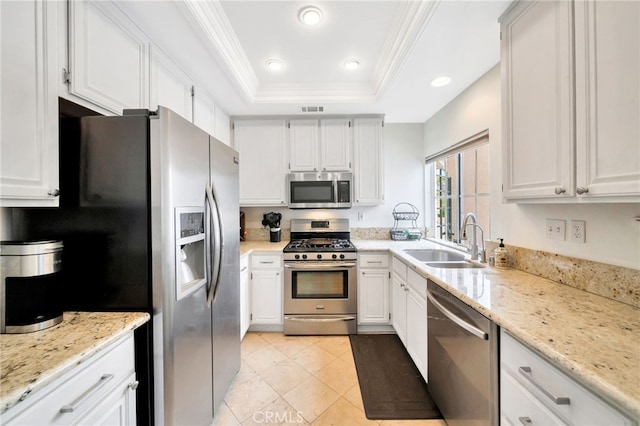 28747 La Triana, Laguna Niguel, CA 92677 - kitchen with appliances with stainless steel finishes, a sink, a raised ceiling, white cabinetry, and ornamental molding