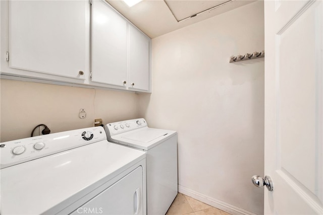 28747 La Triana, Laguna Niguel, CA 92677 - washroom featuring cabinet space, washer and clothes dryer, light tile patterned flooring, and baseboards