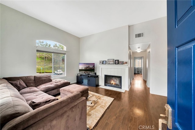 28747 La Triana, Laguna Niguel, CA 92677 - living area with a high ceiling, dark wood-type flooring, a tile fireplace, and baseboards