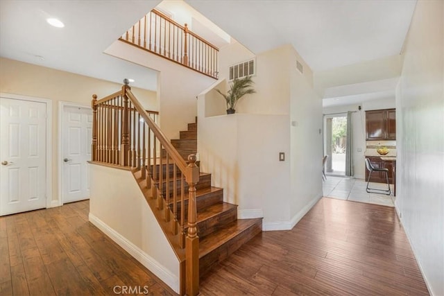 12614 Torrey Pine Rd, Moreno Valley, CA 92555 - stairway with hardwood / wood-style flooring, baseboards, and recessed lighting