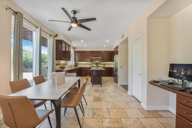 12614 Torrey Pine Rd, Moreno Valley, CA 92555 - dining space with baseboards, stone tile flooring, ceiling fan, an office area, and recessed lighting