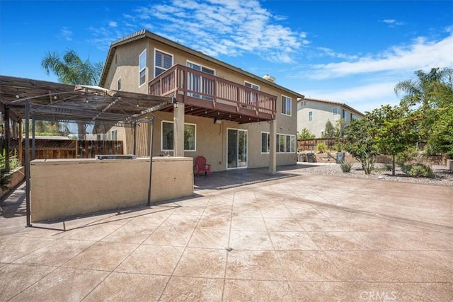 12614 Torrey Pine Rd, Moreno Valley, CA 92555 - back of property featuring stucco siding, a patio, a deck, and a pergola