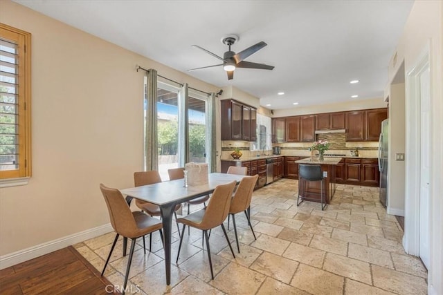 12614 Torrey Pine Rd, Moreno Valley, CA 92555 - dining area featuring a ceiling fan, baseboards, recessed lighting, and stone tile flooring