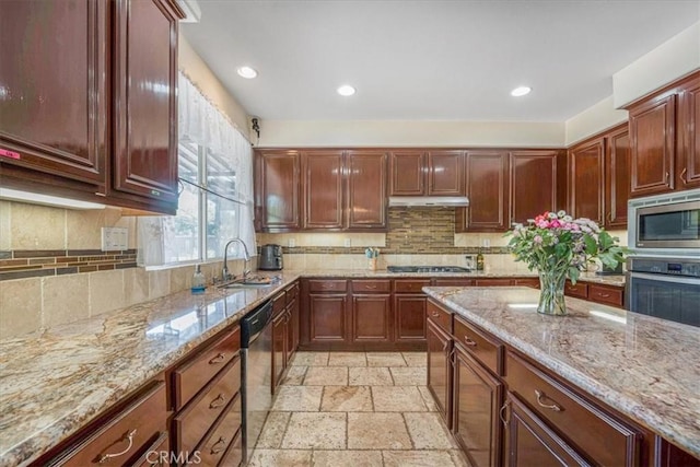 12614 Torrey Pine Rd, Moreno Valley, CA 92555 - kitchen featuring appliances with stainless steel finishes, a sink, stone tile floors, under cabinet range hood, and recessed lighting