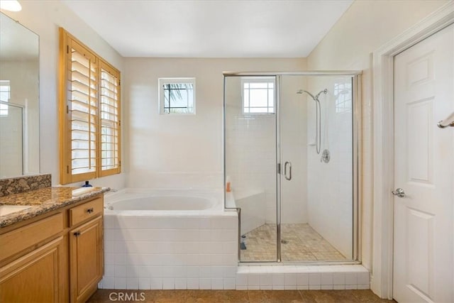 12614 Torrey Pine Rd, Moreno Valley, CA 92555 - bathroom featuring vanity, a garden tub, a stall shower, and tile patterned flooring