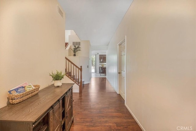 12614 Torrey Pine Rd, Moreno Valley, CA 92555 - hall featuring stairway, dark wood-style flooring, and baseboards