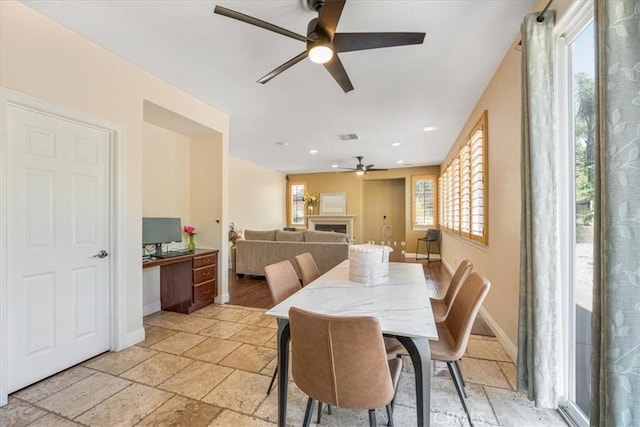 12614 Torrey Pine Rd, Moreno Valley, CA 92555 - dining room with ceiling fan, stone tile flooring, baseboards, and recessed lighting