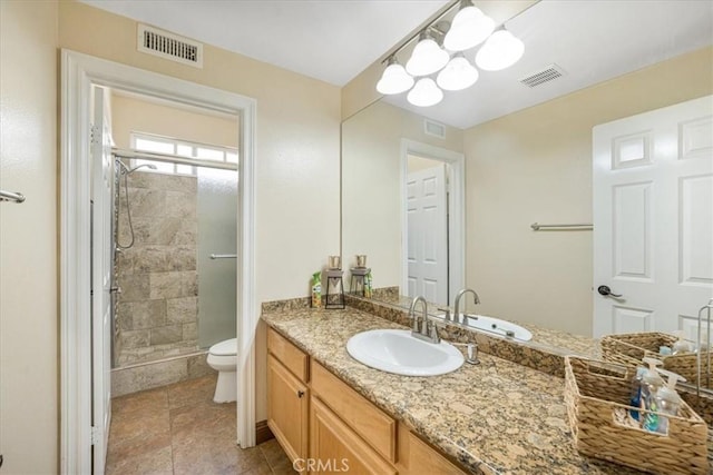 12614 Torrey Pine Rd, Moreno Valley, CA 92555 - bathroom featuring toilet, vanity, a shower stall, and tile patterned flooring