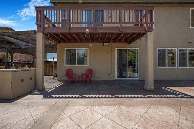 12614 Torrey Pine Rd, Moreno Valley, CA 92555 - rear view of house featuring stucco siding, a patio area, and a wooden deck