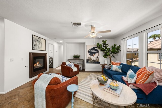 8090 Cornwall Ct Unit 33, Rancho Cucamonga, CA 91739 - living room with ceiling fan, a glass covered fireplace, and baseboards