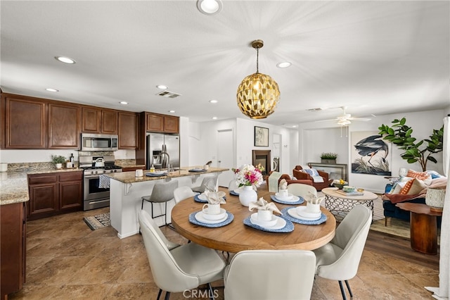 8090 Cornwall Ct Unit 33, Rancho Cucamonga, CA 91739 - dining room with a chandelier, recessed lighting, and ceiling fan