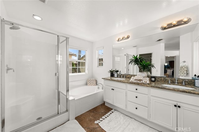8090 Cornwall Ct Unit 33, Rancho Cucamonga, CA 91739 - bathroom with a shower stall, a garden tub, double vanity, tile patterned flooring, and recessed lighting