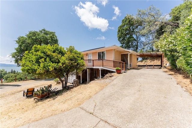 3788 Lakeview Ter, Lucerne, CA 95458 - view of front of house featuring driveway, a deck, and a carport