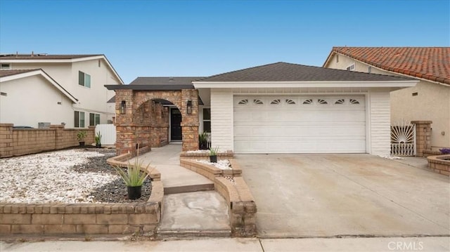 19029 Pires Ave, Cerritos, CA 90703 - view of front of property featuring a garage, concrete driveway, and stone siding