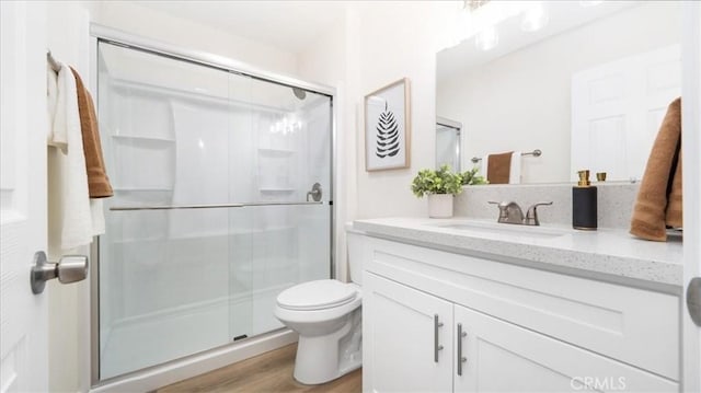19029 Pires Ave, Cerritos, CA 90703 - full bath featuring vanity, a stall shower, toilet, and wood finished floors
