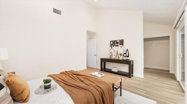 19029 Pires Ave, Cerritos, CA 90703 - bedroom featuring light wood-type flooring, a closet, baseboards, and high vaulted ceiling