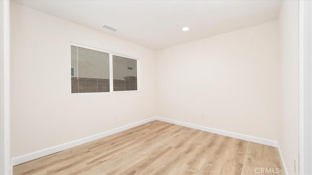 19029 Pires Ave, Cerritos, CA 90703 - empty room featuring baseboards, light wood-style floors, and recessed lighting
