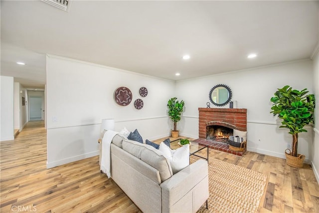 1456 Fernwood Dr, Redlands, CA 92374 - living area with crown molding, light wood finished floors, recessed lighting, a fireplace, and baseboards