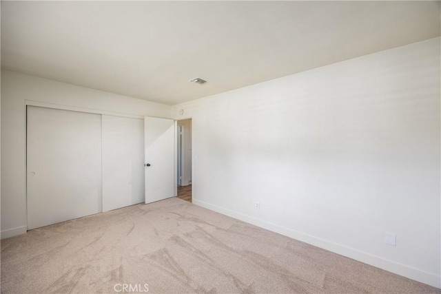 1456 Fernwood Dr, Redlands, CA 92374 - unfurnished bedroom with carpet floors, a closet, and baseboards