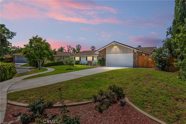 1456 Fernwood Dr, Redlands, CA 92374 - single story home featuring concrete driveway, a garage, board and batten siding, and stone siding