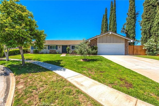 1456 Fernwood Dr, Redlands, CA 92374 - ranch-style house with an attached garage, concrete driveway, and stone siding