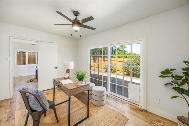 1456 Fernwood Dr, Redlands, CA 92374 - office area featuring baseboards, light wood finished floors, and a ceiling fan