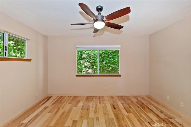 23819 Scenic Dr, Crestline, CA 92325 - spare room with plenty of natural light, wood finished floors, a ceiling fan, and baseboards