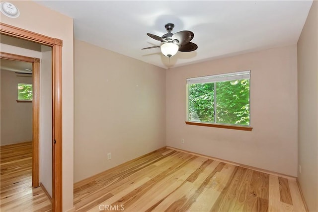 23819 Scenic Dr, Crestline, CA 92325 - unfurnished room featuring wood finished floors, healthy amount of natural light, and a ceiling fan