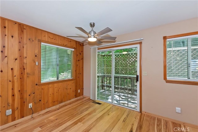 23819 Scenic Dr, Crestline, CA 92325 - spare room with ceiling fan, wood finished floors, wooden walls, and baseboards