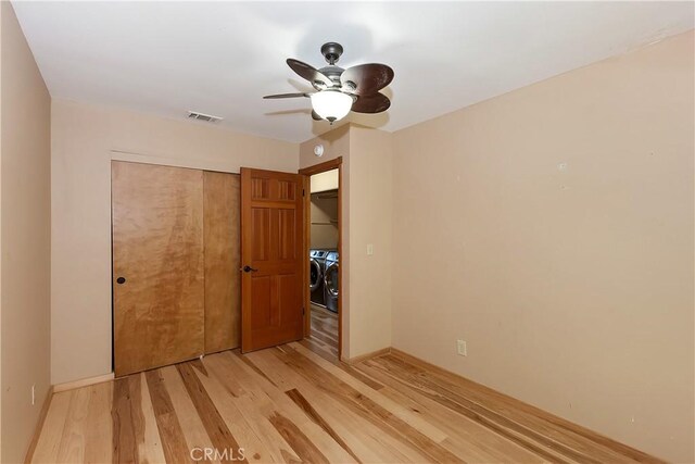 23819 Scenic Dr, Crestline, CA 92325 - unfurnished bedroom featuring light wood-style flooring, a closet, baseboards, and a ceiling fan