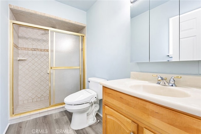 9232 S 7th Ave, Inglewood, CA 90305 - bathroom featuring vanity, toilet, a shower stall, and wood finished floors