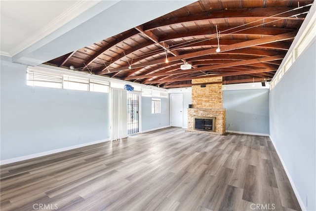 9232 S 7th Ave, Inglewood, CA 90305 - unfurnished living room with wooden ceiling, wood finished floors, baseboards, and a fireplace