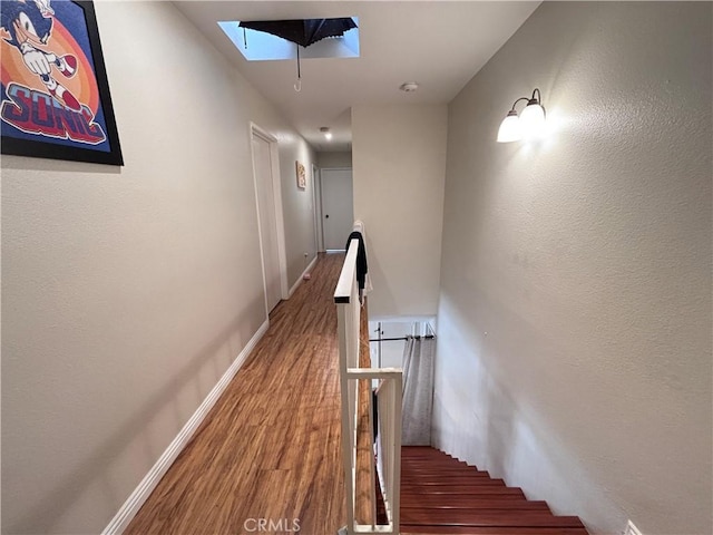 9900 Tagus St Unit 30, Pico Rivera, CA 90660 - stairway with a skylight and wood finished floors