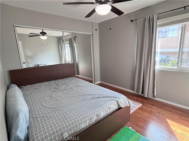 9900 Tagus St Unit 30, Pico Rivera, CA 90660 - bedroom featuring wood finished floors, baseboards, ceiling fan, and a closet