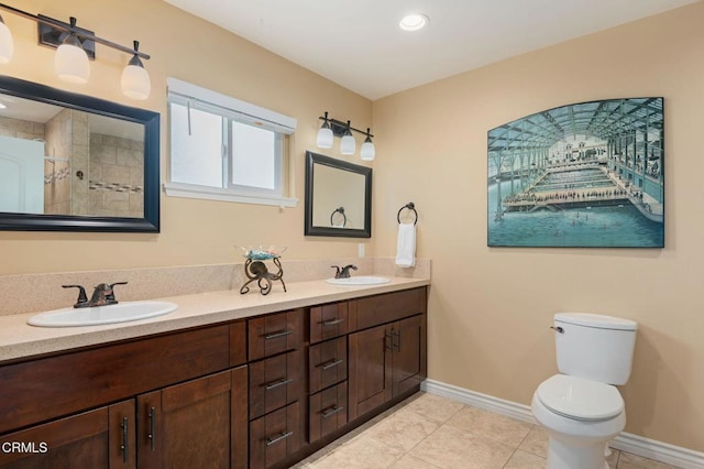 1796 Swift Ave, Ventura, CA 93003 - full bath with toilet, tile patterned floors, baseboards, double vanity, and recessed lighting