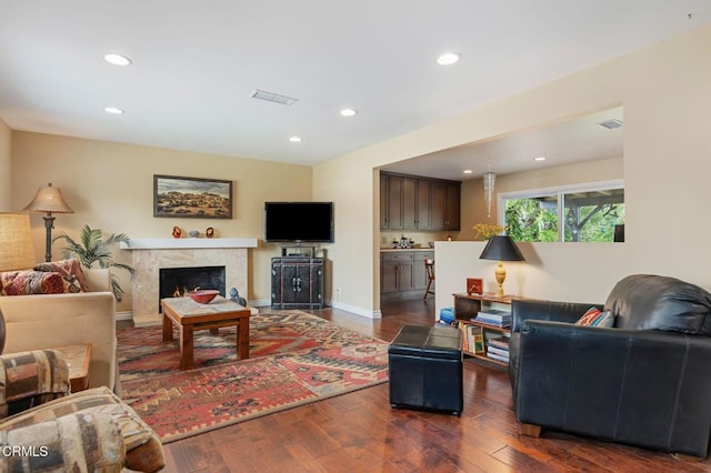 1796 Swift Ave, Ventura, CA 93003 - living area with dark wood-type flooring, recessed lighting, a premium fireplace, and baseboards