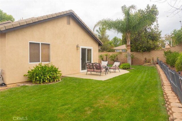 980 Creston Way, Beaumont, CA 92223 - rear view of property with a patio and stucco siding