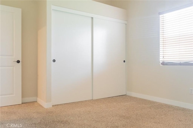 980 Creston Way, Beaumont, CA 92223 - unfurnished bedroom featuring carpet flooring, a closet, and baseboards