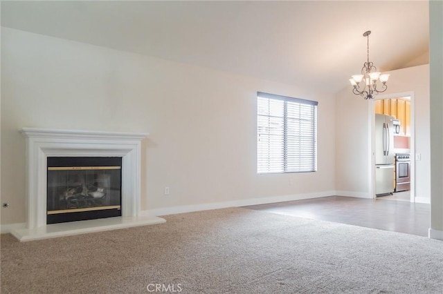 980 Creston Way, Beaumont, CA 92223 - unfurnished living room with carpet flooring, a chandelier, vaulted ceiling, baseboards, and a glass covered fireplace