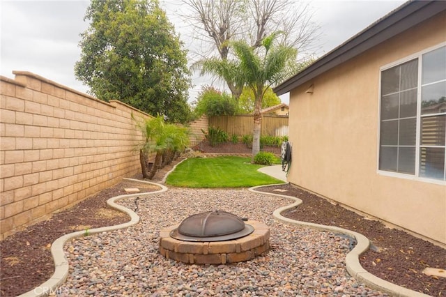 980 Creston Way, Beaumont, CA 92223 - fenced backyard with a fire pit