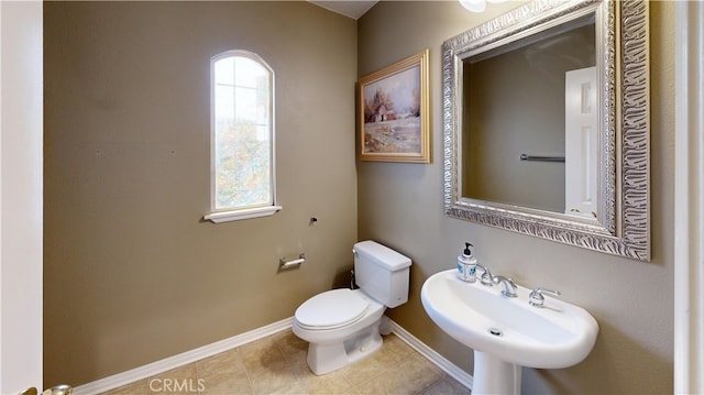 4322 Waterside Ln, Oxnard, CA 93035 - half bath featuring a sink, toilet, baseboards, and tile patterned floors