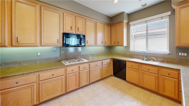 4322 Waterside Ln, Oxnard, CA 93035 - kitchen featuring black appliances, a sink, light brown cabinetry, light stone counters, and light flooring