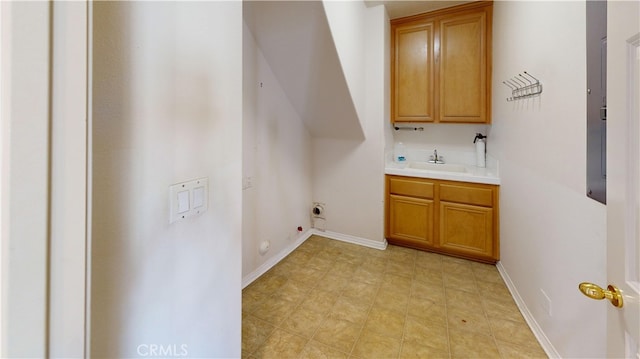 4322 Waterside Ln, Oxnard, CA 93035 - washroom featuring hookup for an electric dryer, cabinet space, wet bar, and baseboards